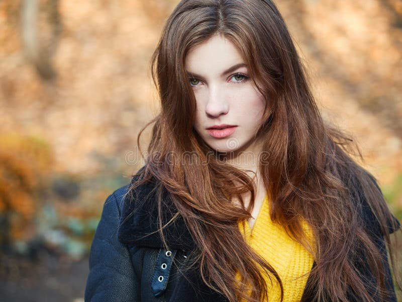 Pretty Redhead With Long Red Hair And Yellow Jacket